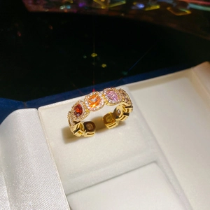 Detailed close-up of 14k gold plated ring with colorful zircon stones in a gift box