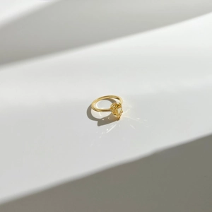 Macro shot of S925 sterling silver ring featuring a yellow pear-cut gemstone
