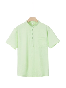Detail of light green seersucker shirt fabric texture and Henley collar design