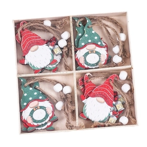 Set of four handcrafted wooden Christmas gnome ornaments with rustic twine and white beads