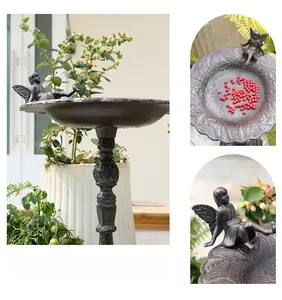 Detalle del comedero para pájaros en hierro fundido vintage con escultura de hada