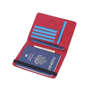 Red RFID passport holder with lychee texture featuring card slots and elastic strap