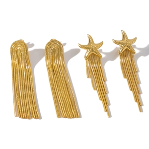 18K gold plated stainless steel long tassel earrings with starfish design on white background