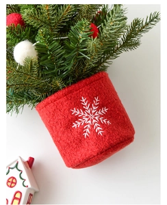 Miniature pine Christmas tree with red felt base and white snowflake embroidery detail