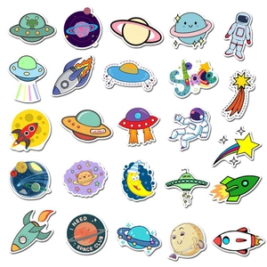 Detailed macro view of cute cartoon space stickers with UFO and astronaut designs