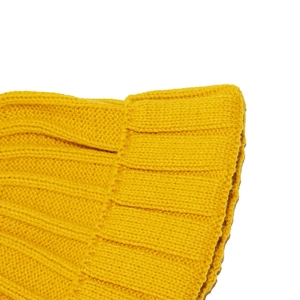 Close-up of bright yellow ribbed knit beanie featuring thick texture and wide folded cuff