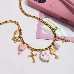 Gold gothic punk layered necklace with cross and tulip charms on chunky chain links