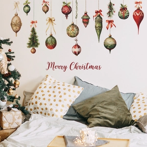 Watercolor Christmas wall stickers with festive ornaments and trees on a bedroom wall