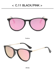 Detail view of oval kids sunglasses C.11 with black frames and pink lenses