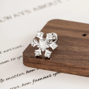 Elegant snowflake cartilage stud earring with cubic zirconia in coffee gold finish