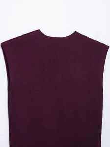 Detail of high-quality dark purple knit sleeveless top showing fine ribbed texture