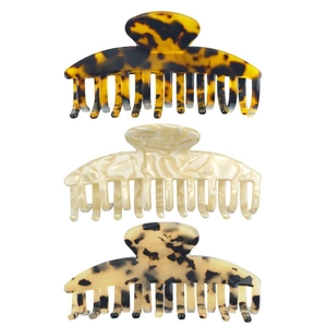 Set of three acetate hair claws in tortoiseshell, white marble, and leopard patterns