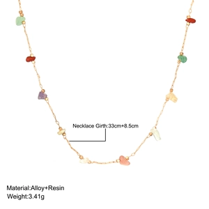 Detail shot of vintage resin stone necklace with alloy chain weight and length specs