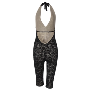 Detail view of black lace jumpsuit with halter neck and open back design shown on ghost mannequin