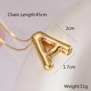 Detailed view of golden A-letter balloon pendant with 45cm chain and size dimensions