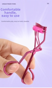 Detail showing magenta stainless steel eyelash curler with ergonomic handle and silicone pad