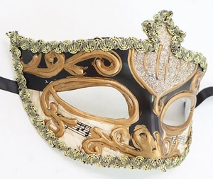 Detailed close-up of a Venetian masquerade mask featuring gold baroque relief and musical patterns