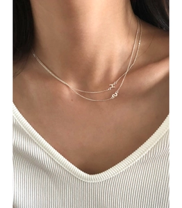 Double-layered S925 sterling silver necklace featuring H letter pendant on a model