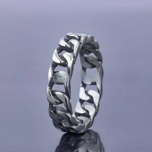 Detailed view of silver stainless steel Cuban link chain ring with industrial style