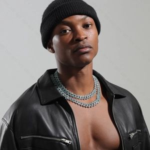 Detail of silver plated 15mm cuban link chain with rhinestones on male model
