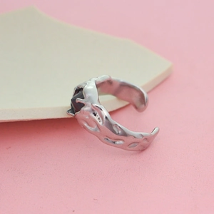 Minimalist silver open ring with irregular lava texture and black zircon gemstone accent