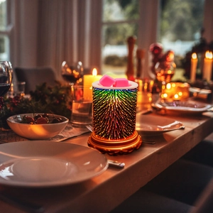 Close-up of pink soy wax melts on top of a 3D fireworks glass electric wax warmer