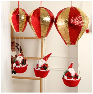 Close-up of Santa Claus hanging hot air balloon decoration with red and gold foil details