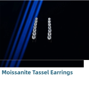 Macro shot of Moissanite long tassel earrings in 925 sterling silver with sparkling stones