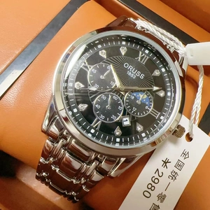 Macro shot of ORUSS men's watch with black dial and silver steel band on leather case