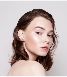 Classic 925 sterling silver six-prong moissanite stud earring worn by a model