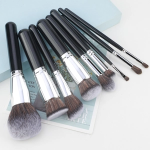 Detail of 8 professional makeup brushes with soft synthetic bristles and black handles