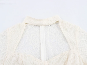 Close-up of beige lace dress back featuring invisible zipper and sweetheart neckline detail