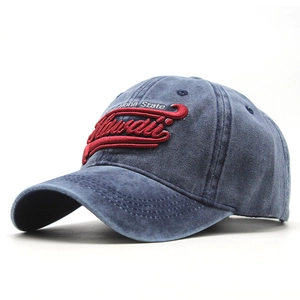 Close-up of vintage washed blue baseball cap with 3D Hawaii embroidery and metallic eyelets