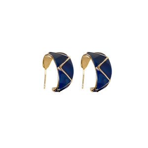 Vintage gold and blue enamel C-shaped earrings with geometric triangle patterns