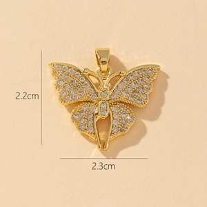 Macro view of gold butterfly pendant with cubic zirconia, size 2.2cm by 2.3cm