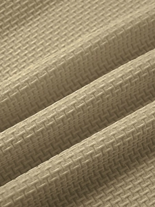Close-up of beige waffle knit fabric texture for men's breathable summer sports t-shirt