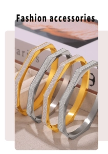Close-up of geometric octagonal gold and silver bangles with pavé crystal accents