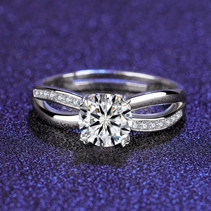 Macro shot of round brilliant cut zircon ring with a double-layered pavé-set twisted band