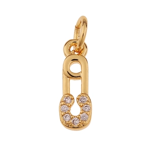 Detail of a golden paperclip pendant with sparkling crystals on a clean white background