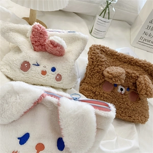 Detailed view of plush animal-themed organizer bags with cute bunny and bear embroidery