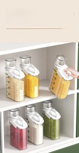 Detail of 1.8L kitchen storage container with measuring cup lid and portable handle