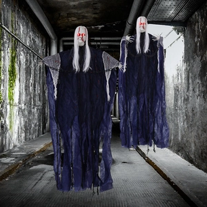 Hanging Halloween ghosts with glowing red eyes, white hair and bloody faces in dark tunnel