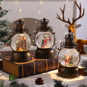 Close-up of retro Christmas lantern with swirling glitter and festive miniature scene