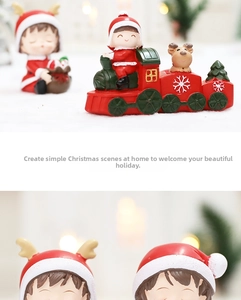 Close-up of resin Christmas train ornaments with cute girl and reindeer figurines