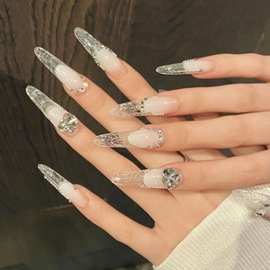 Handmade stiletto press-on nails with ice-crack texture, crystals, and pearls