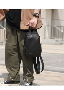 Detailed view of a black waterproof crossbody chest bag with matte finish for urban style
