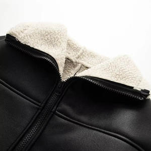Women's black faux leather jacket with white faux shearling collar and zipper detail