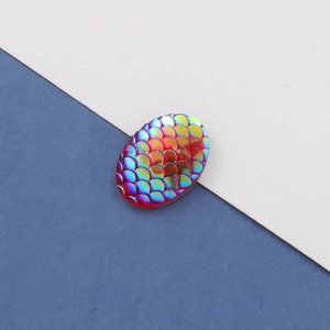 Close-up of 13x18mm oval fish scale resin cabochons with iridescent rainbow AB coating