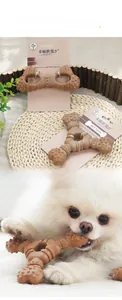Durable brown dog teething toy with textures shown in use by a small dog on a mat