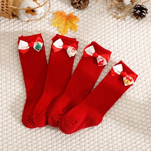 Festive red Christmas baby crew socks with bow and cartoon holiday patterns in 4-pair set